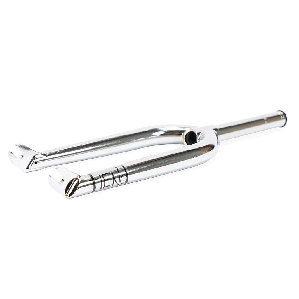 The Fiend Meta Forks, made from heat-treated chromoly tubing, feature a shiny silver finish, a rigid dropout design for secure wheel axle attachment, and an engraved logo near the crown.