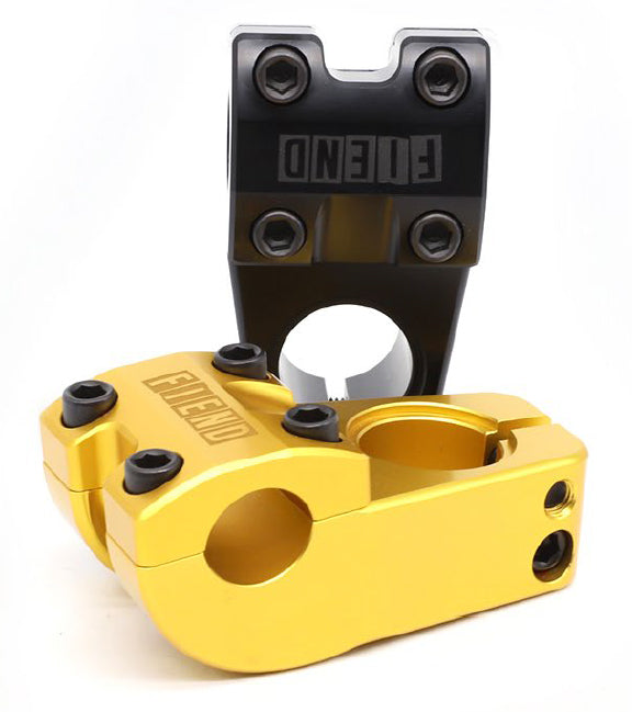 Two Fiend Ransom Top Load Stems—one gold, one black, each with "FIEND" branding and a 48mm reach—are shown upright, leaning against each other.