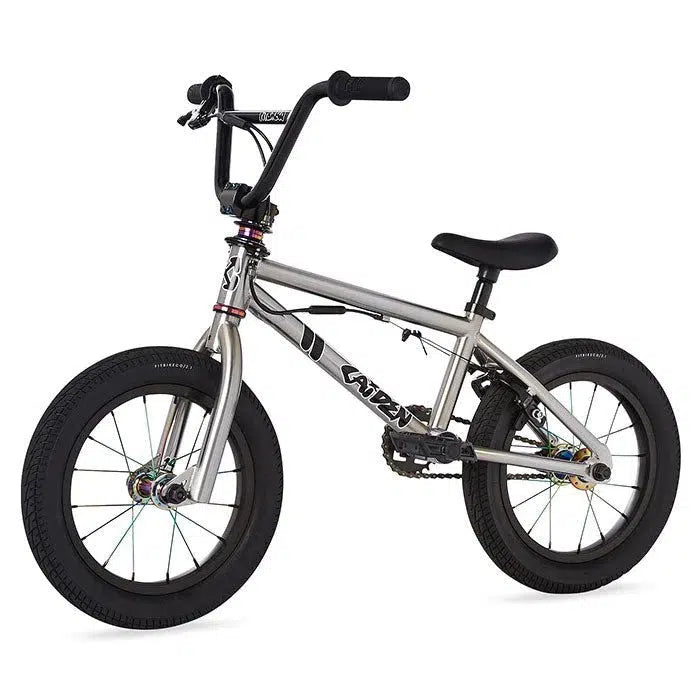 A silver Fit Misfit 14 Inch Bike (2023) / Caiden Cernius Signature on a white background.