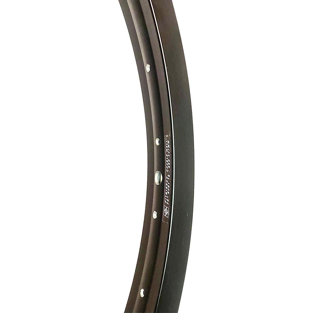 A black curved Fit 26 inch Rim with white dots.