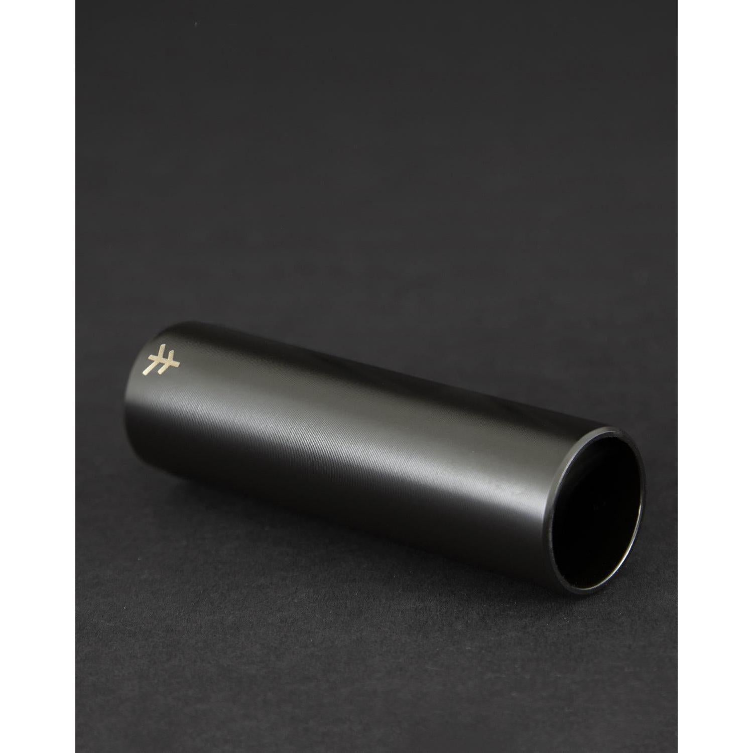 A black, cylindrical Fly Bikes Acero ST Peg with a subtle logo at one end, CNC Machined from 4140 Cr-Mo for durability, sits against a dark background.