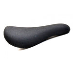Fly Bikes Dos PC Tripod Seat (NOS) showcases a black textured fabric cover, the iconic "Fly Bikes" logo on the side, and a lightweight plastic base for enhanced performance. Pictured against a white background.
