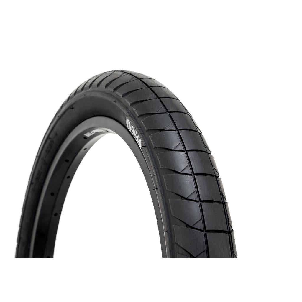 The Fly Bikes Fuego 18 Inch Tyre STD, with its smooth and textured tread pattern and sidewall protection for durability, is displayed against a plain white background.
