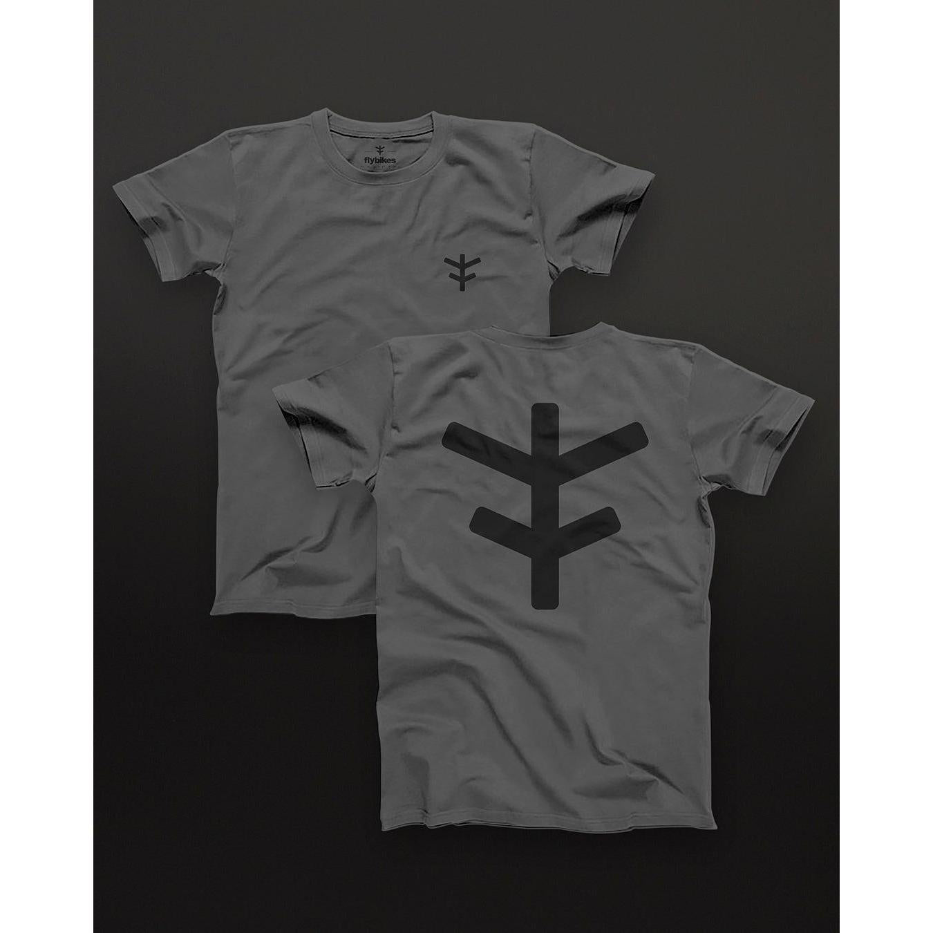 The Fly Bikes Logo Tee is a gray t-shirt made from organic cotton, featuring a geometric black symbol on the front and back. This GOTS-certified piece represents sustainable fashion effortlessly, set against a dark background.