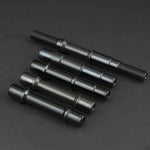 Four replacement Fly Bikes Magneto Female Front Axles on a black surface.