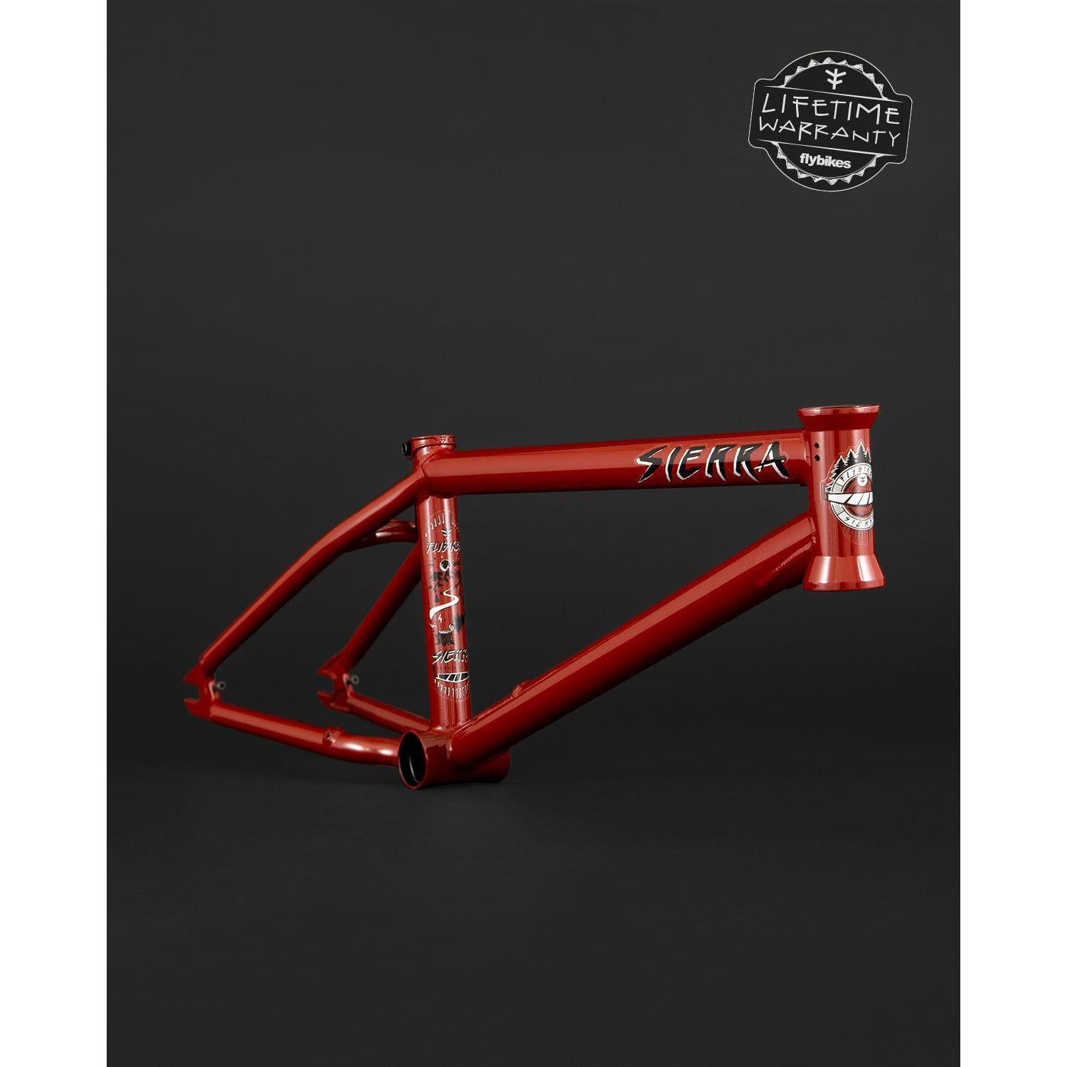The Fly Bikes Sierra 18" Frame, sporting "Sierra" branding on a dark background, boasts a sleek design. With a "Lifetime Warranty" label at the top right, it offers assurance in this premium build inspired by Sergio Layos' signature style.