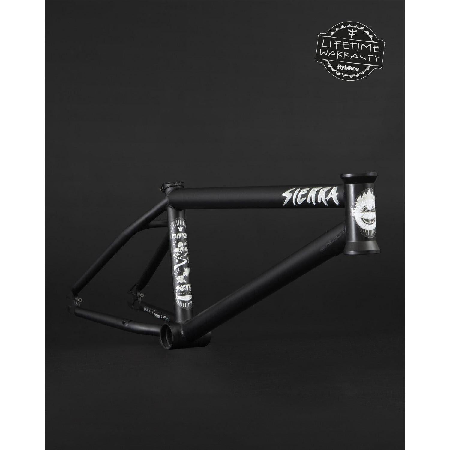Fly Bikes Sierra 18" frame displays graphic designs on a dark background and includes a "Lifetime Warranty" badge at the top right.