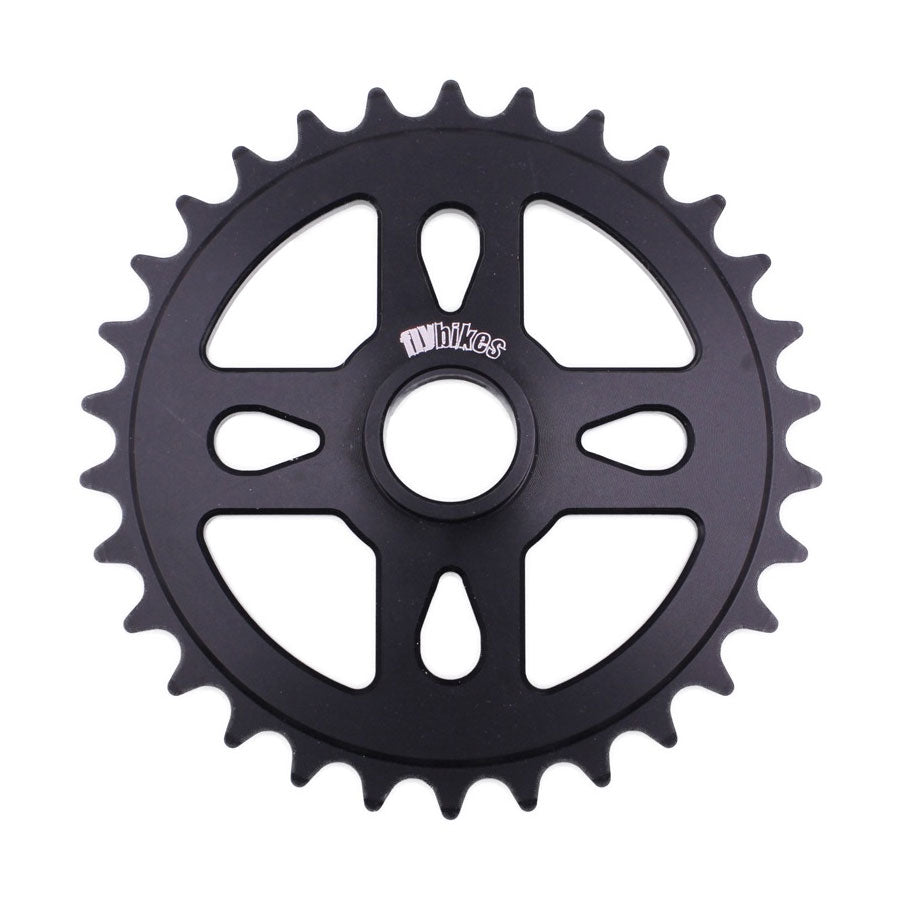 The Fly Bikes Spacer Sprocket is a stylish and durable black 25-tooth bicycle sprocket crafted from CNC machined high-quality 6061 alloy, featuring a central hub with the Flybikes graphic print.