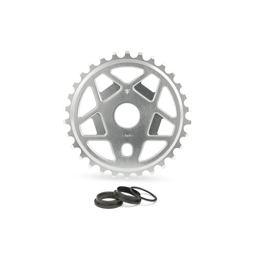 The Fly Bikes Tractor TT Sprocket, made from durable 6061 T-6 Aluminum, sports a stylish five-spoke design and center hole, enhanced by three black spacers for optimal performance.