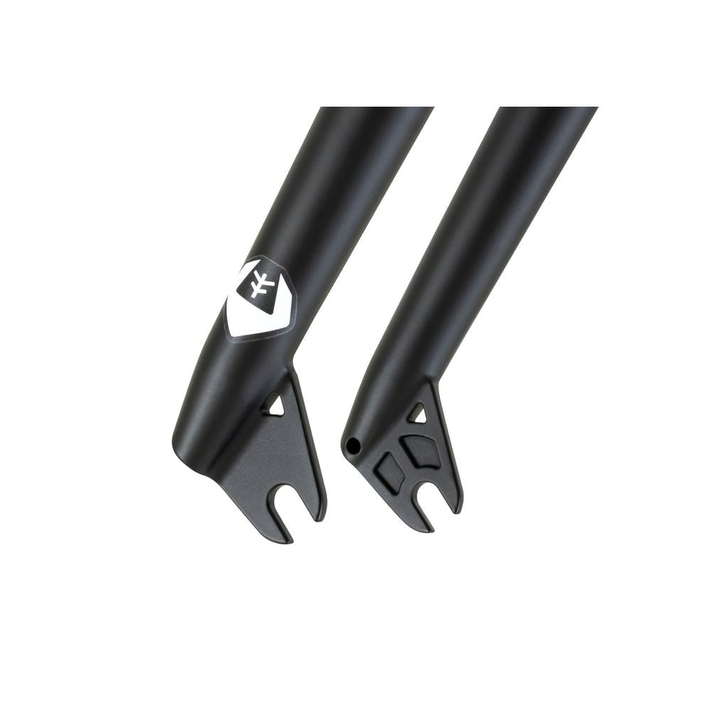 Close-up of two black Fly Bikes Volcano Forks ends, showcasing a white emblem logo. The design features sleek curves, ample tire clearance, and axle cutouts, ideal for BMX steer-tubes.