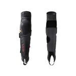 The Fuse Delta 125 Knee/Shin/Ankle Combo Pads (Pair) are shown in black, with one displaying the branded padded outer surface and the other revealing the inner neoprene lining and fastening straps for impact protection.