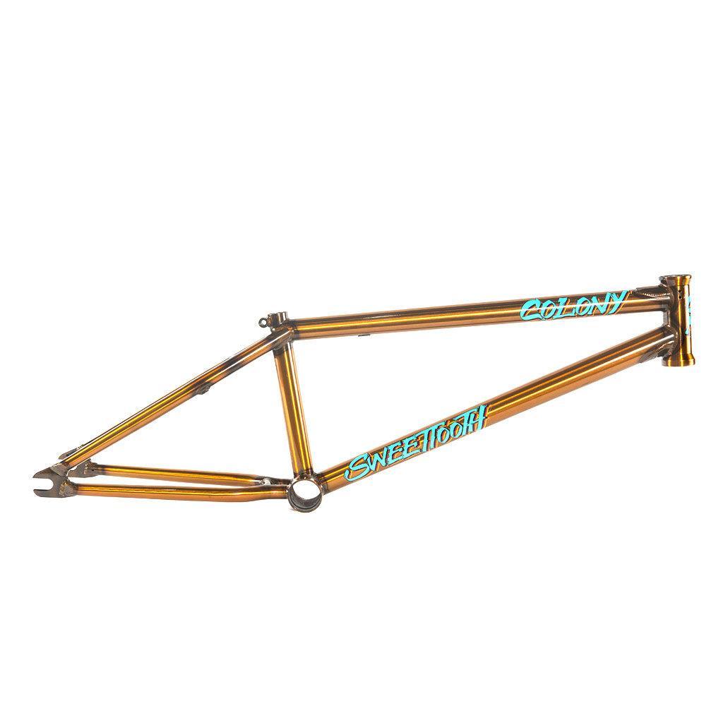 The Colony 2024 Sweet Tooth Frame, in bronze, features decals on the top and bottom tubes, offering progressive park & street geometry for an enhanced ride.