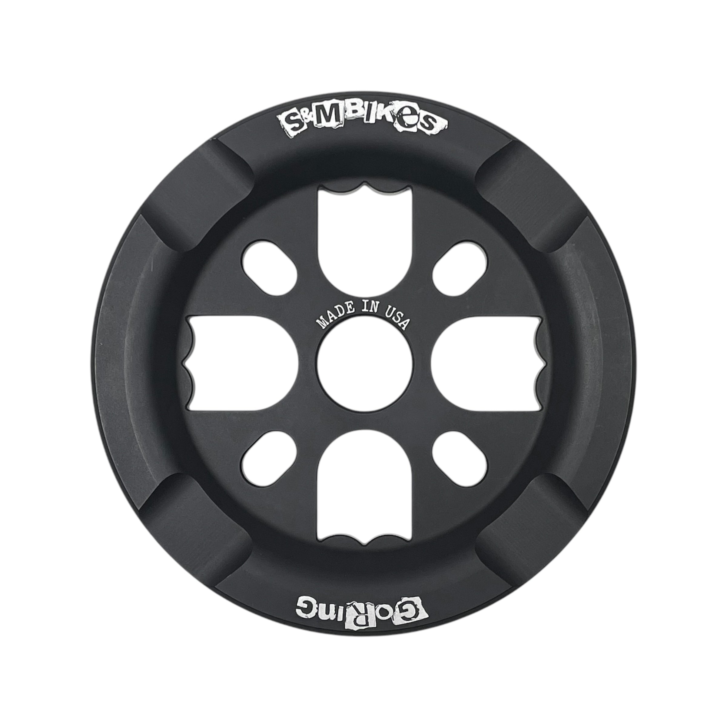 The S&M Goring Guard Sprocket is a black, round BMX sprocket with a cut-out design, CNC machined from 6061 T-6 alloy. It features “GOring” and “S&M BIKES” logos and is marked “MADE IN USA” at the center.