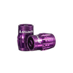 Two purple Granite Juicy Valve Caps with grooved cylindrical designs and branding are shown against a white background, designed for easy installation in a tubeless setup.