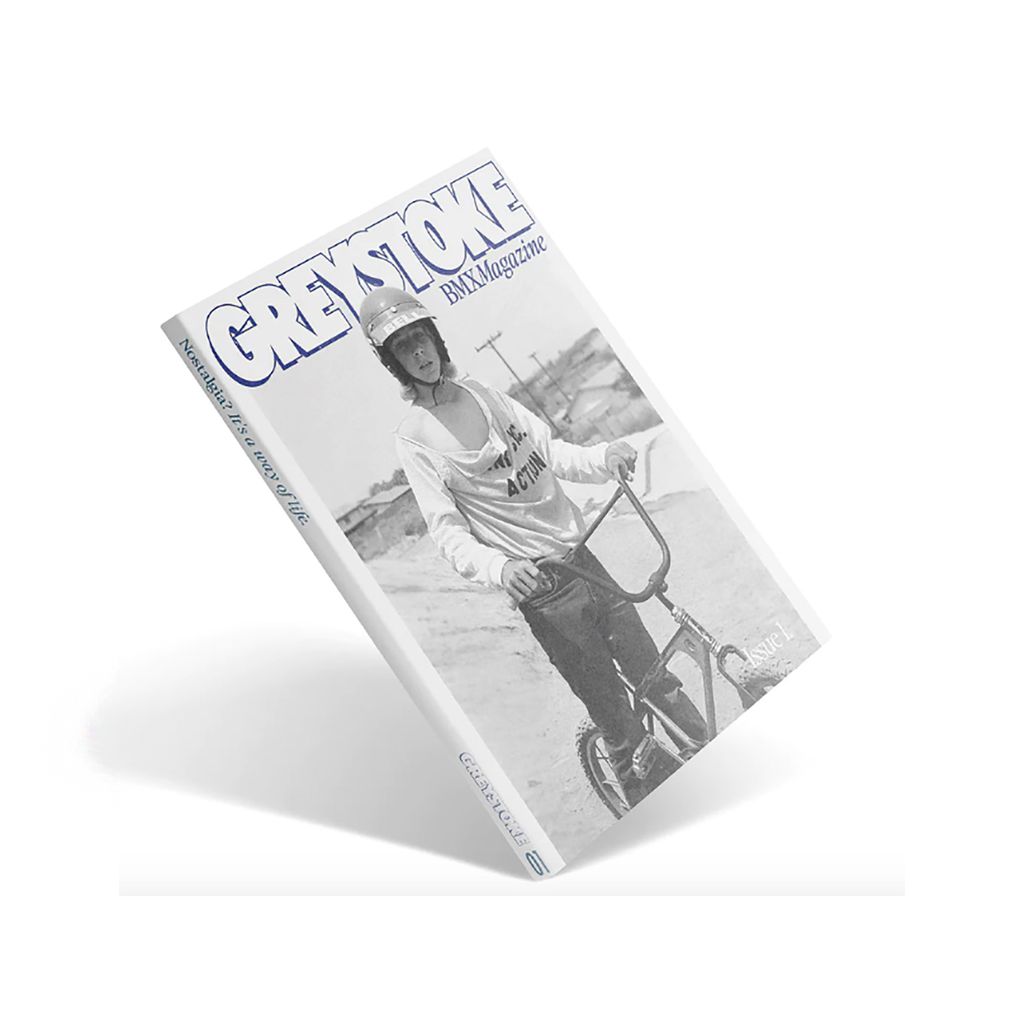 A Greystoke Magazine 01 featuring a man on a bike, showcasing the thrilling world of riding bikes.