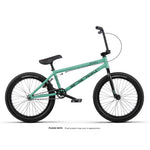 The Wethepeople Arcade 20 Inch Bike is a teal mid-tier BMX with black Salt Valon rims, matching handlebars and seat, and "WE THE PEOPLE" branding on the frame, shown in profile on a white background.