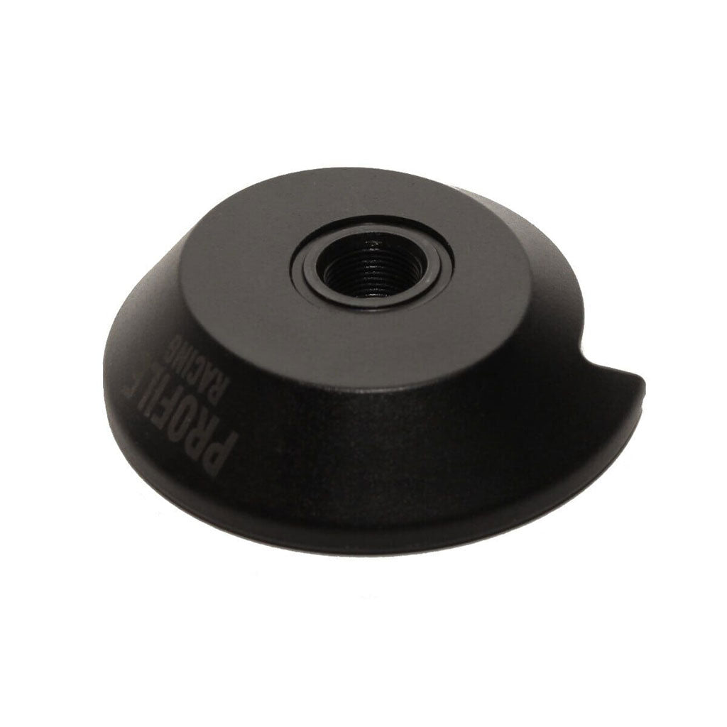 The Profile (Madera) Mini, Elite, Z-Coaster Drive Side Hub Guard is a black injection-molded plastic guard with a central threaded hole for 14mm rear cassette hubs. "PROFILE RACING" text appears on the side against a white background.