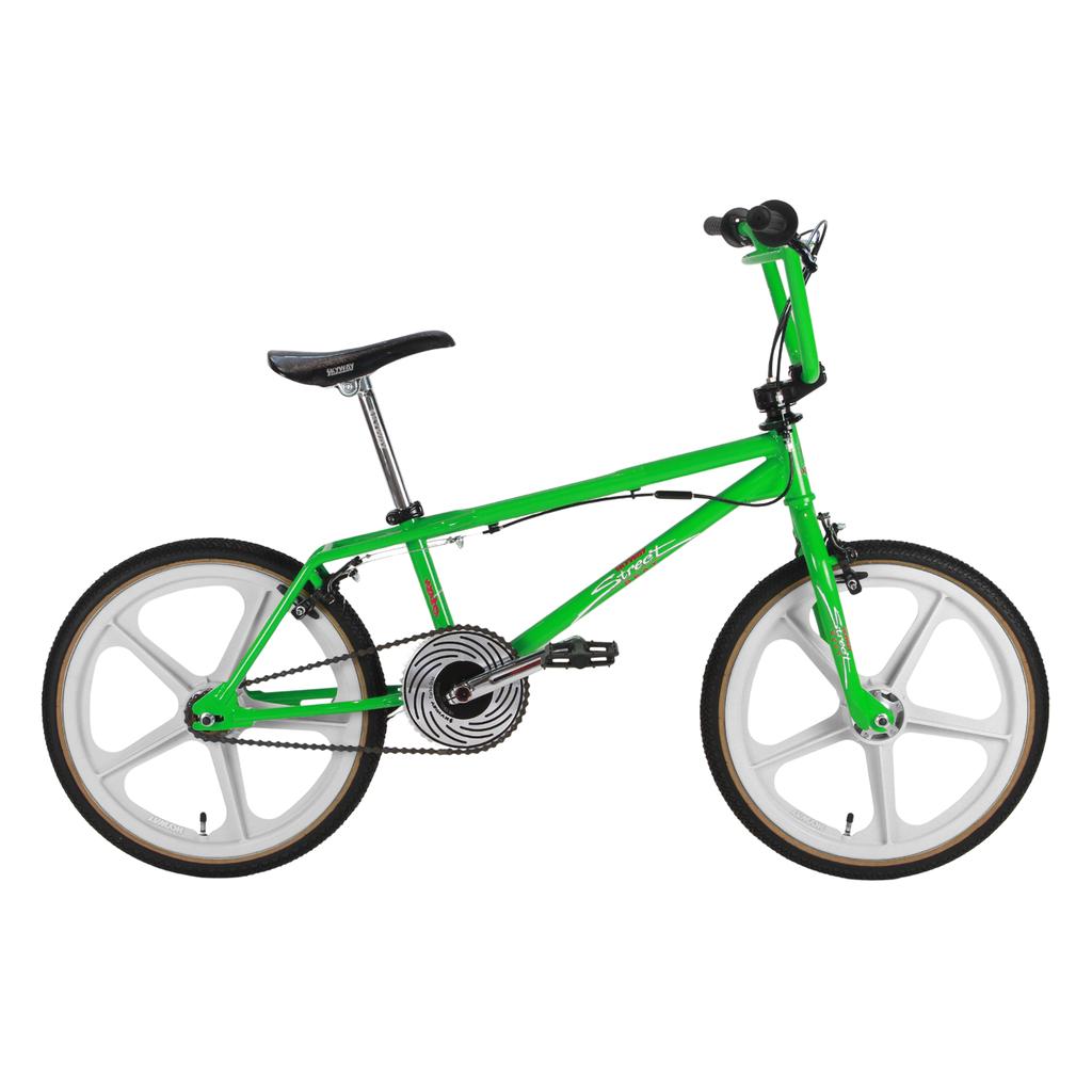 The Skyway Street Beat EX 20 Inch Bike in green features a black seat, white mag wheels, multi-gear crankset, and a durable 4130 chromoly frame, shown in profile on a white background.