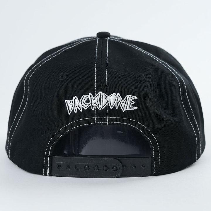 The Backbone Heart Logo 5 Panel Hat is a stylish black cap with white stitching, featuring "BACKBONE" elegantly embroidered in white on the back. Its snapback closure ensures a perfect fit, while the Aussie BMX influence adds an adventurous touch.