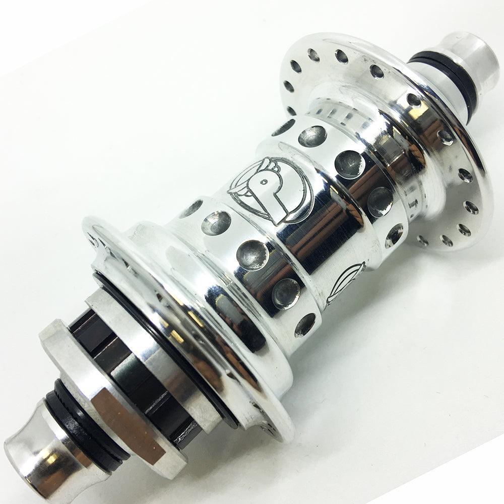 Close-up of a polished silver Profile High Flange Cassette Hub (48H) featuring multiple spoke holes, black accents, and an engraved logo on the center barrel.