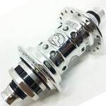 Close-up of a polished silver Profile High Flange Cassette Hub (48H) featuring multiple spoke holes, black accents, and an engraved logo on the center barrel.