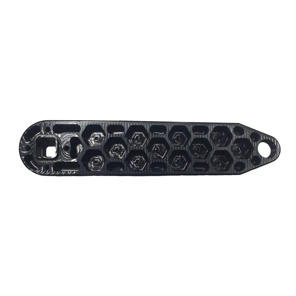 Black 3D-printed plastic part with a row of hexagonal holes and a round hole at one end, shown on a white background—perfect for pairing with the Rennen Hive Mini Square Tapered Cranks for your custom build.