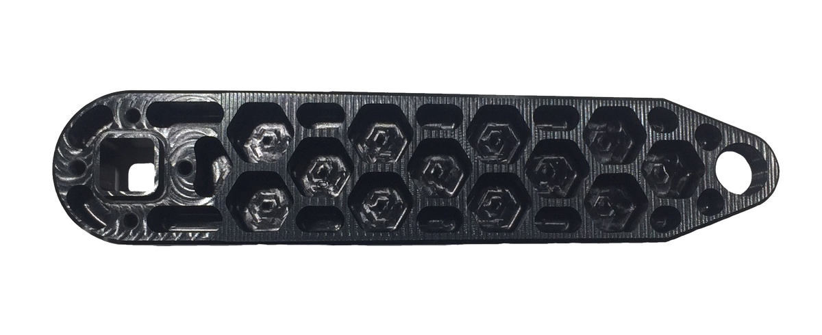 Black 3D-printed plastic part with a row of hexagonal holes and a round hole at one end, shown on a white background—perfect for pairing with the Rennen Hive Mini Square Tapered Cranks for your custom build.