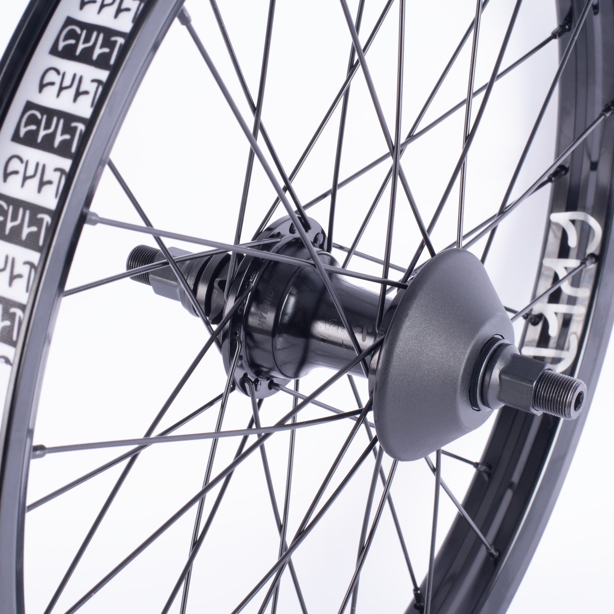 Close-up of a black Cult Hybrid FC Wheel featuring a hybrid BMX hub, spokes, bolts, and rim against a white background.