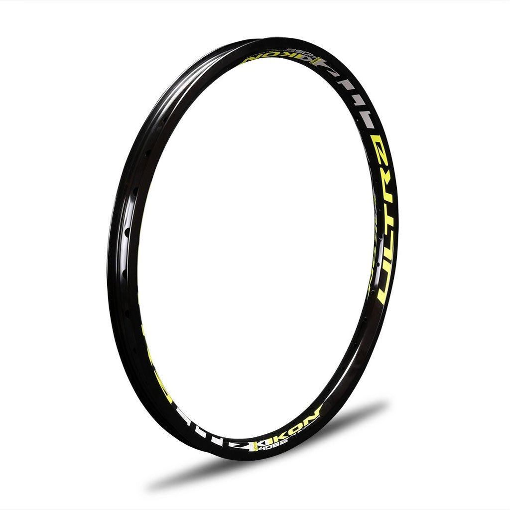 A black IKON ALLOY RIM (20 x 1.75 BRAKE) with yellow lettering on it, featuring a brake surface.