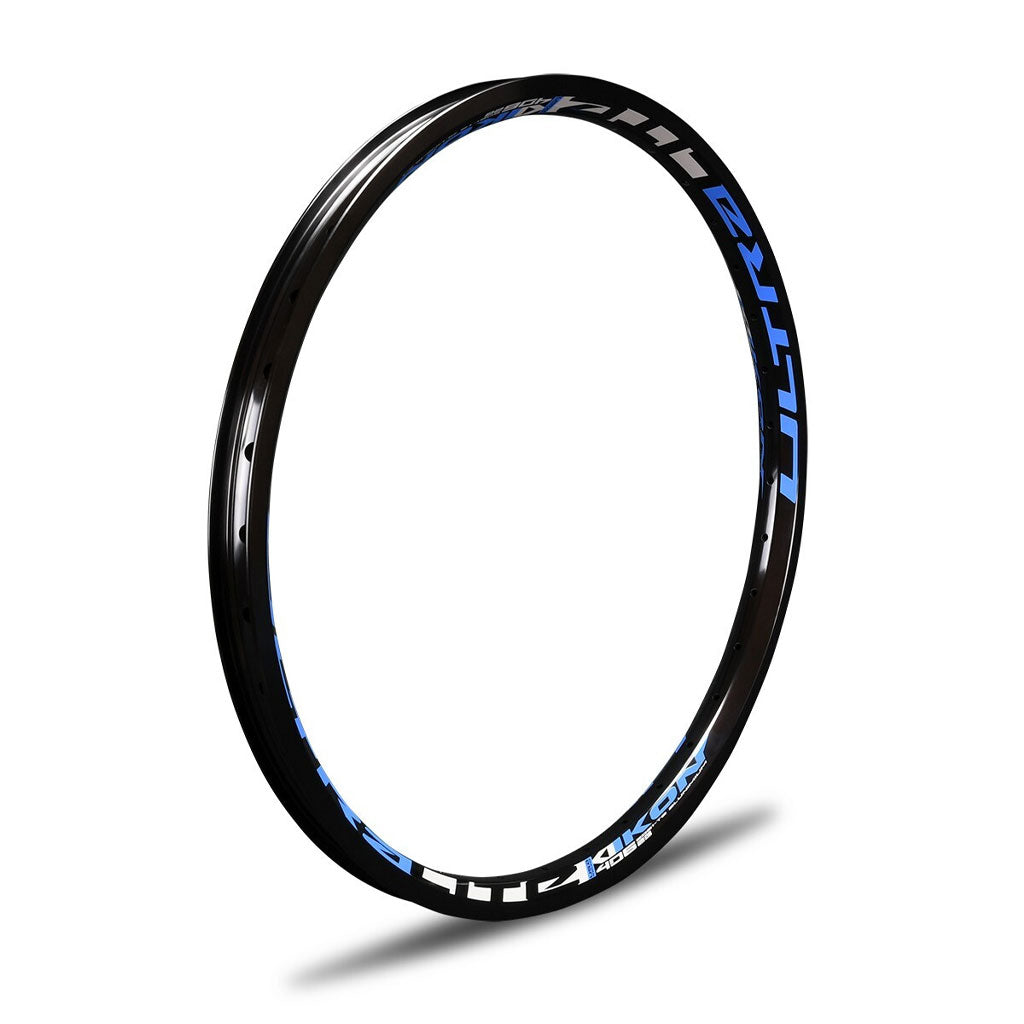 A black IKON ALLOY RIM (20 x 1.75 BRAKE) with blue lettering on it, designed for BMX racing.