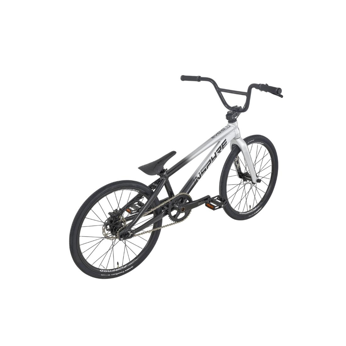 A silver Inspyre EVO-C Expert Race Bike (2027) BMX with black handlebars, seat, and tires is displayed on a white background, angled to showcase the rear wheel and drivetrain. This model is equipped with SD B-85 cranks for efficient pedaling and a carbon Pride fork for responsive steering.