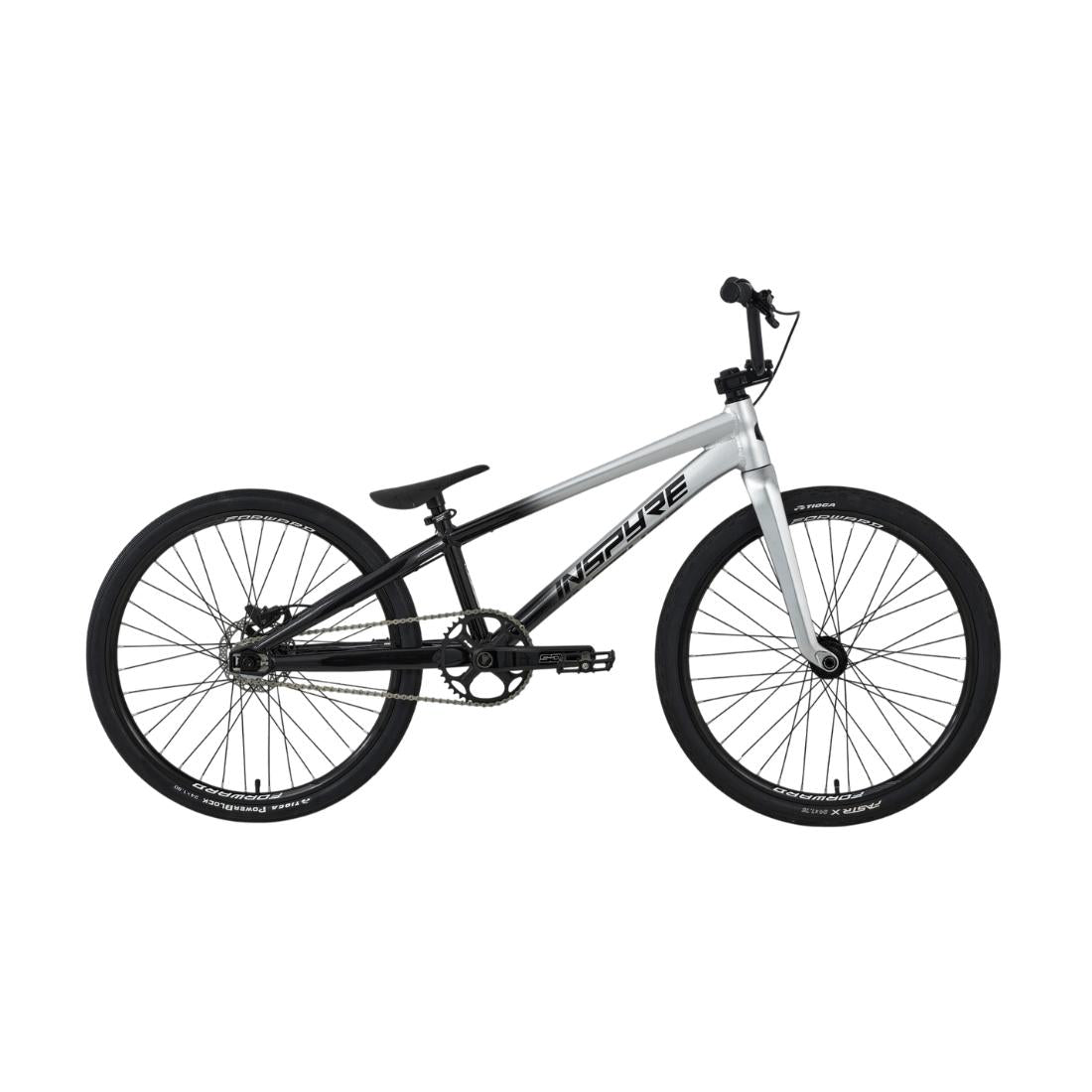The Inspyre EVO-C Pro Cruiser Race Bike (2027), featuring a silver and black BMX-style design with a lightweight frame, flat handlebars, thick tires, and an advanced carbon Pride fork, is shown in side view against a white background.