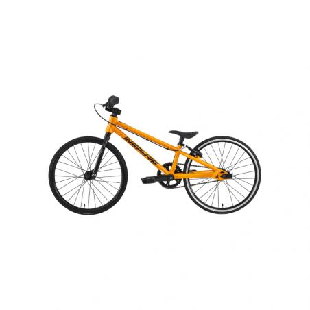The Inspyre Neo Micro Race Bike (2027) is an orange BMX-style bicycle showcased in profile against a white background, featuring black handlebars, seat, and wheels. Designed as an entry-level race bike with an 18-inch wheel micro design, it’s ideal for young riders beginning their racing journey.