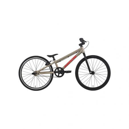 The Inspyre Neo Mini Race Bike (2027) is a beige BMX-style bicycle with red branding, a black seat, handlebars, and wheels—shown from the side on a white background—that makes an excellent entry-level race bike for beginner riders.