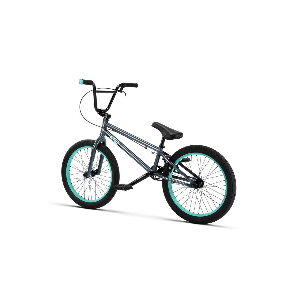 The Radio Saiko 20 Inch Bike features a gray frame, black handlebars and seat, black tires with teal rims, and Salt Tracer Tyres, displayed on a white background.
