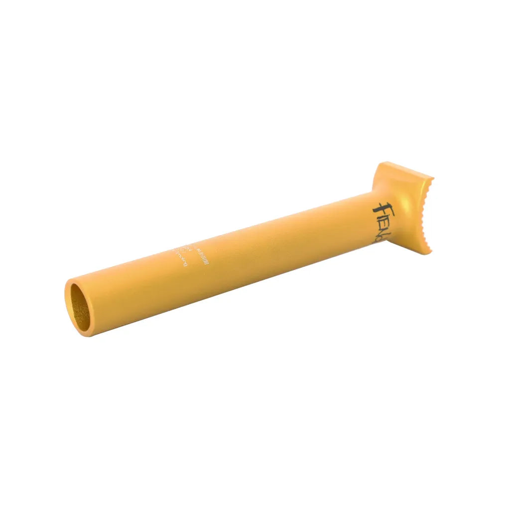 The Fiend Pivotal Post 185mm is a yellow, cylindrical metal tube with a flat, serrated end and "Fiend" text printed on the side, displayed against a white background.