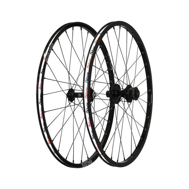 The Box Three Expert Disc Wheel Set 28 Hole—black, spoked bicycle wheels with Box Three hubs—is displayed upright side by side on a white background.