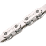 Close-up of a KMC Z1 eHX Race Chain on a white background.