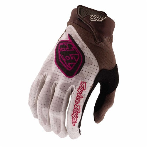 The TLD 26.1 Air Glove in Dark Olive/Pumice features a white grid pattern, brown and black accents, and pink and red "Troy Lee Designs" branding—ideal for mountain bike glove enthusiasts.