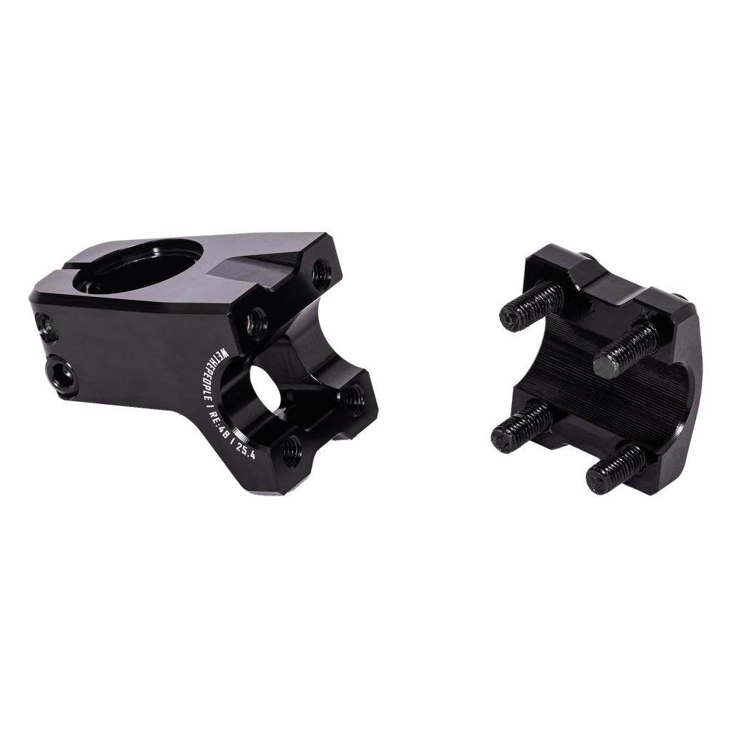 The WeThePeople Logic Front Load Stem, in black with a removable faceplate, features Shark Tooth Clamping and four threaded bolts. CNC machined and shown on a white background.