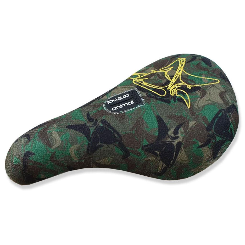 The Animal Luv Pivotal Seat is a cushioned bicycle seat with a green camouflage pattern featuring bird silhouettes, reinforced by a Kevlar cover, and adorned with an Animal Griffin Head logo tag.