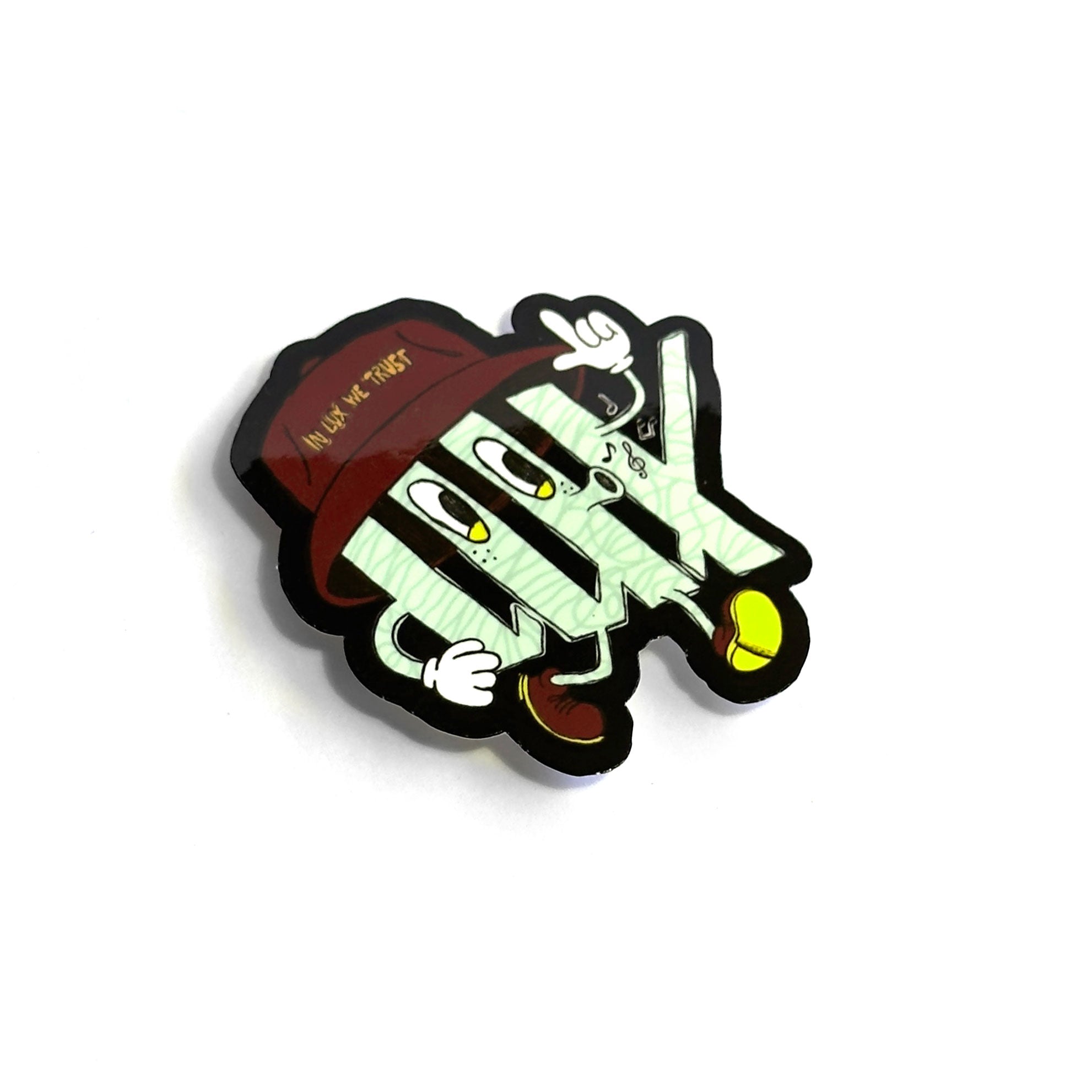 A whimsical cartoon character resembling a folded stack of money, decked out in gloves, shoes, and a red hat featuring the words "Inka Trap," makes for an ideal design on the LUXBMX Whistling Logo Sticker. Crafted from waterproof vinyl, this sticker is built to last.