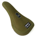 Green bicycle saddle with Merritt Brandon Begin Slim Pivotal Seat branding on a white background.