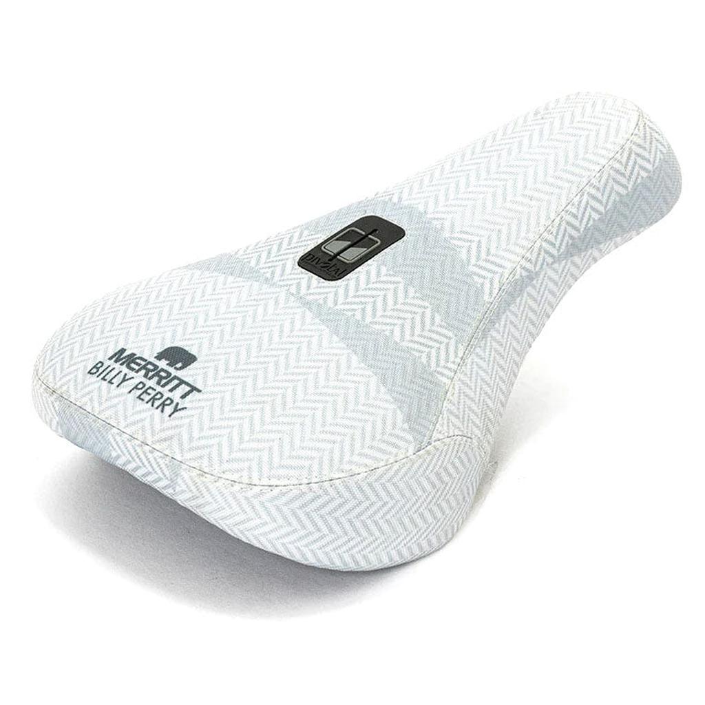 The Merritt Billy Perry Pivotal Seat features a white herringbone canvas cover, "MERRITT BILLY PERRY" text, and a logo patch—making it a stylish, durable upgrade for your bike.