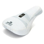 The Merritt Billy Perry Pivotal Seat features a white herringbone canvas cover, "MERRITT BILLY PERRY" text, and a logo patch—making it a stylish, durable upgrade for your bike.