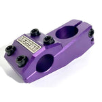 Purple Merritt Inaugural MKII Top Load Stem with "merit" logo, featuring four clamping bolts and two steerer tube bolts, isolated on a white background.