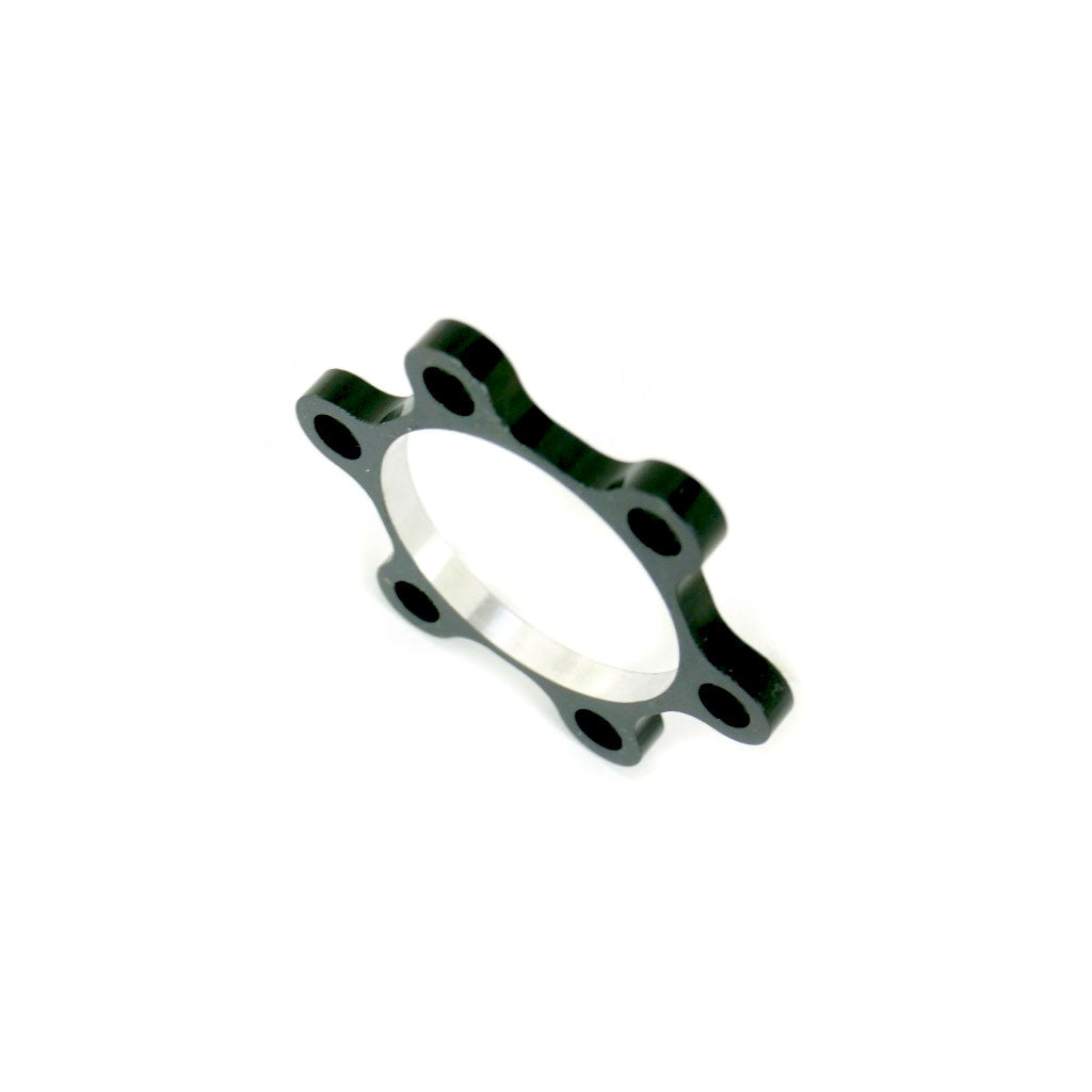 A black and green Meybo HSX Disk Spacer on a white background, inspired by Meybo.