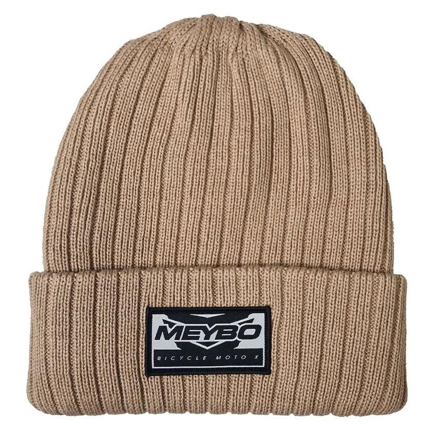 The Meybo Wing Beanie is a beige ribbed knit hat with a folded brim, featuring a black and white "Meybo Bicycle Moto X" patch—ideal for winter or any Meybo fan.