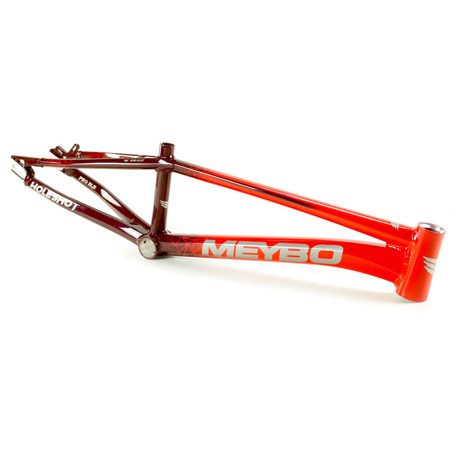 A Meybo 2024 Holeshot Expert XL Frame BMX race bike with a red frame and the word "meyo" on it.