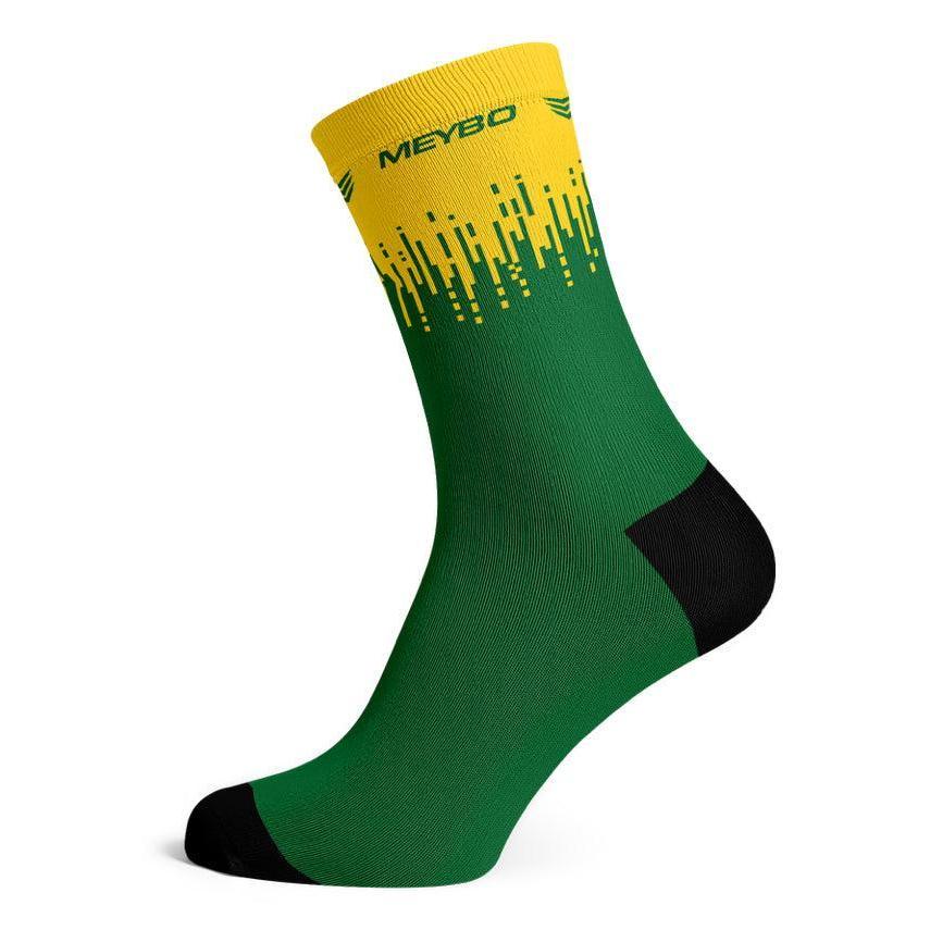 Certainly! Here’s a rewritten version using the product data: The Meybo Sock Ribbed Crew features a green body with a yellow band at the top, yellow geometric design, black heel and toe, and “MEYBO” text near the cuff—making these socks perfect for your next road adventure or relaxing recovery ride.